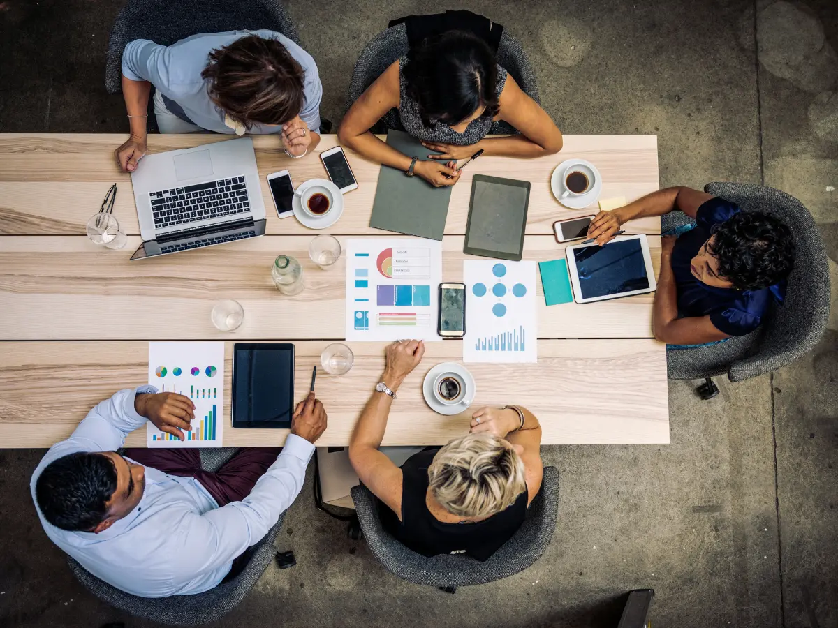 MBA students studying around a table.